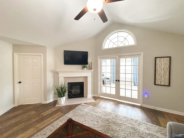 2072 Madison Villas Way Unit 2072, Madison, AL 35758 - living area featuring a ceiling fan, a tiled fireplace, wood finished floors, lofted ceiling, and baseboards