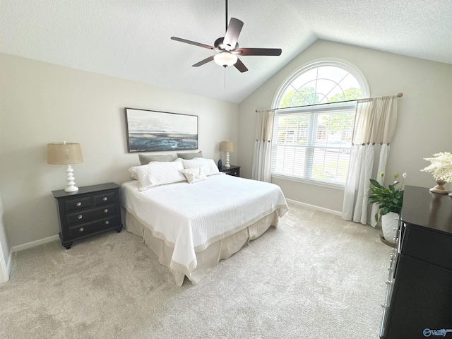 2072 Madison Villas Way Unit 2072, Madison, AL 35758 - bedroom featuring light colored carpet, vaulted ceiling, baseboards, a ceiling fan, and a textured ceiling