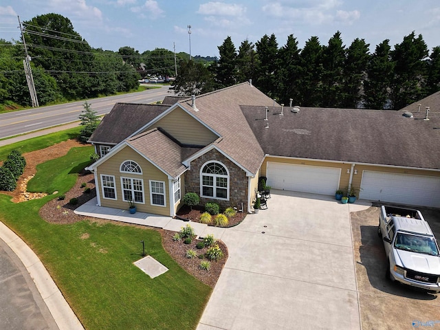2072 Madison Villas Way Unit 2072, Madison, AL 35758 - view of front of property featuring roof with shingles, driveway, stone siding, a front yard, and an attached garage