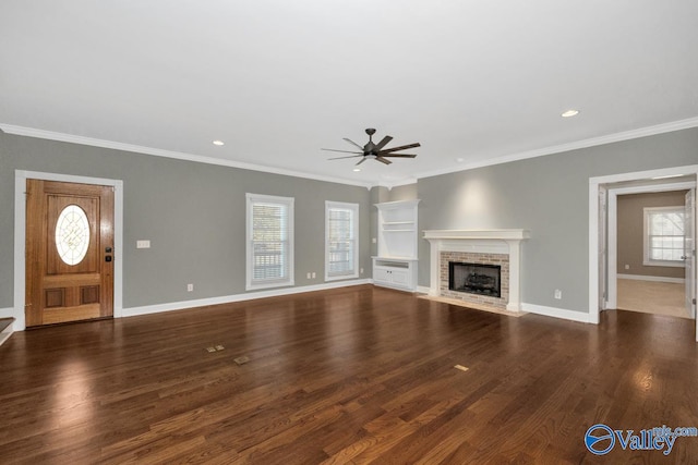 unfurnished living room featuring ceiling fan, crown molding, and dark hardwood / wood-style flooring