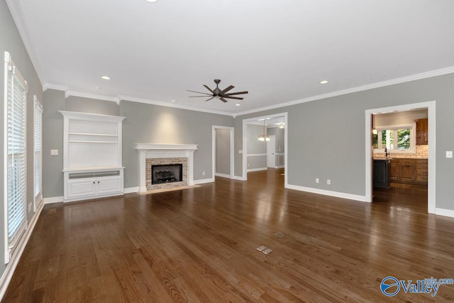 unfurnished living room with dark hardwood / wood-style floors and crown molding