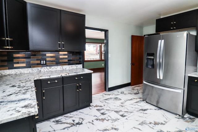 6670 Moores Mill Rd, Huntsville, AL 35811 - kitchen featuring dark cabinets, decorative backsplash, stainless steel refrigerator with ice dispenser, and marble finish floor