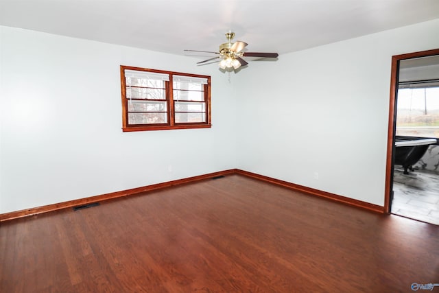 6670 Moores Mill Rd, Huntsville, AL 35811 - unfurnished room with baseboards, a ceiling fan, wood finished floors, and visible vents