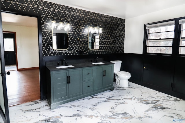 6670 Moores Mill Rd, Huntsville, AL 35811 - bathroom with double vanity, a sink, marble finish floor, and toilet
