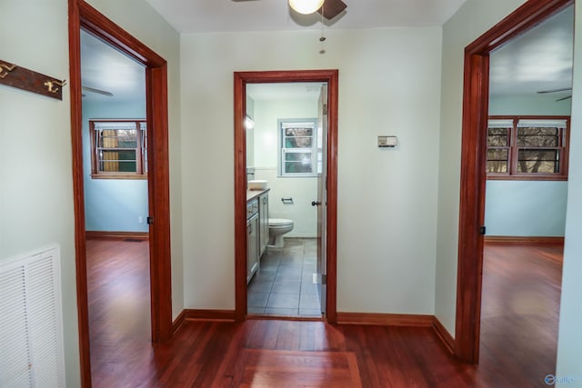 6670 Moores Mill Rd, Huntsville, AL 35811 - corridor with baseboards, dark wood finished floors, and visible vents