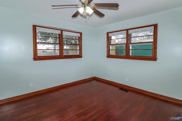 6670 Moores Mill Rd, Huntsville, AL 35811 - empty room featuring baseboards, ceiling fan, dark wood-style flooring, and visible vents