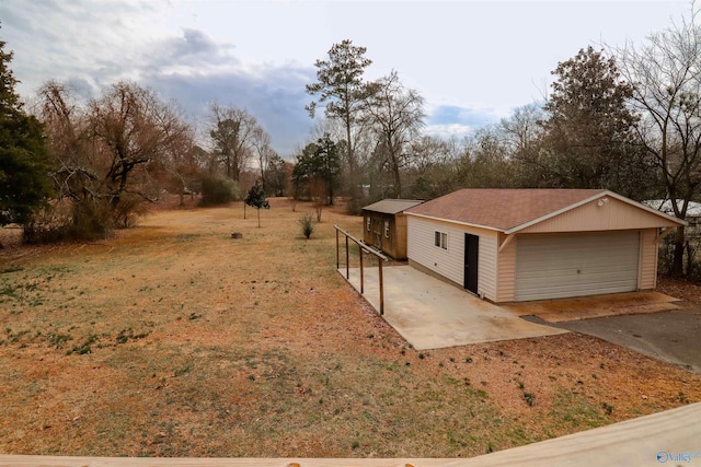 6670 Moores Mill Rd, Huntsville, AL 35811 - view of yard with an outdoor structure and a detached garage