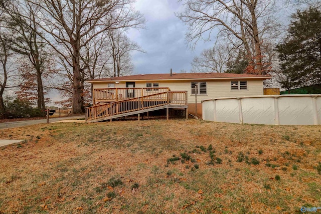6670 Moores Mill Rd, Huntsville, AL 35811 - back of property featuring a lawn, a wooden deck, and an outdoor pool