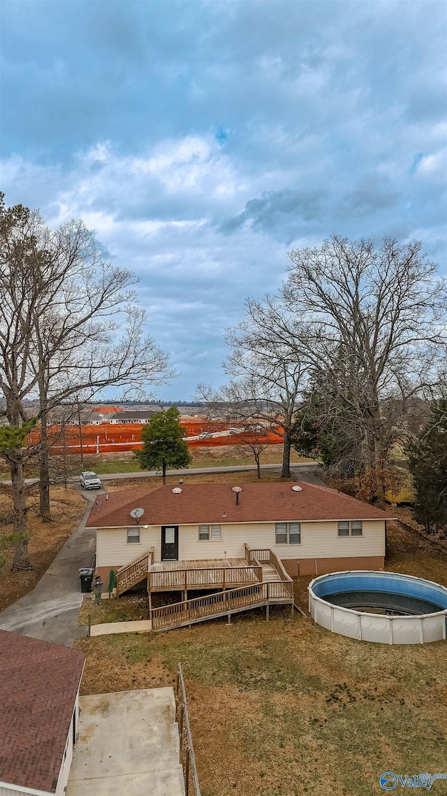 6670 Moores Mill Rd, Huntsville, AL 35811 - rear view of house with a lawn, a wooden deck, and an outdoor pool