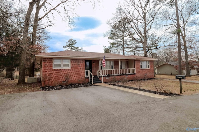 6670 Moores Mill Rd, Huntsville, AL 35811 - ranch-style home featuring driveway, a porch, brick siding, and crawl space