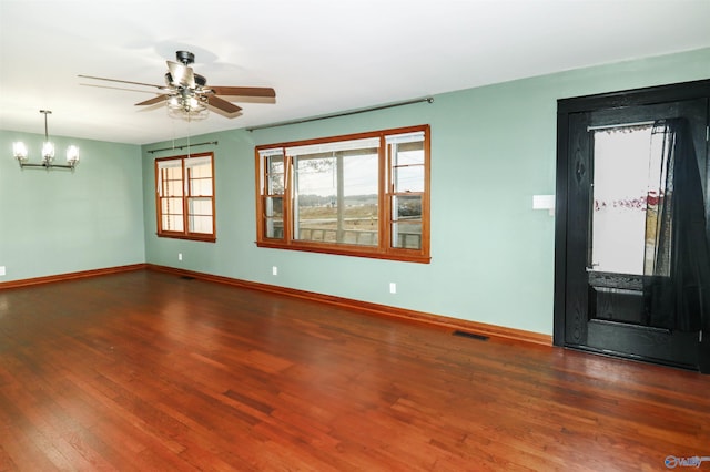 6670 Moores Mill Rd, Huntsville, AL 35811 - spare room with baseboards, ceiling fan with notable chandelier, wood finished floors, and visible vents