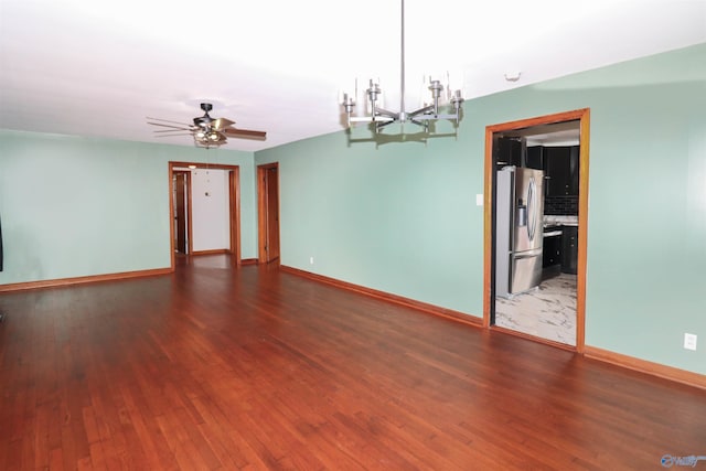 6670 Moores Mill Rd, Huntsville, AL 35811 - empty room featuring baseboards, ceiling fan with notable chandelier, and wood finished floors