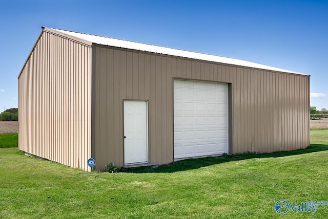 garage with a lawn