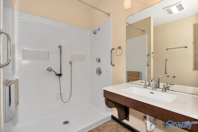 bathroom with a tile shower