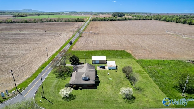 birds eye view of property with a rural view