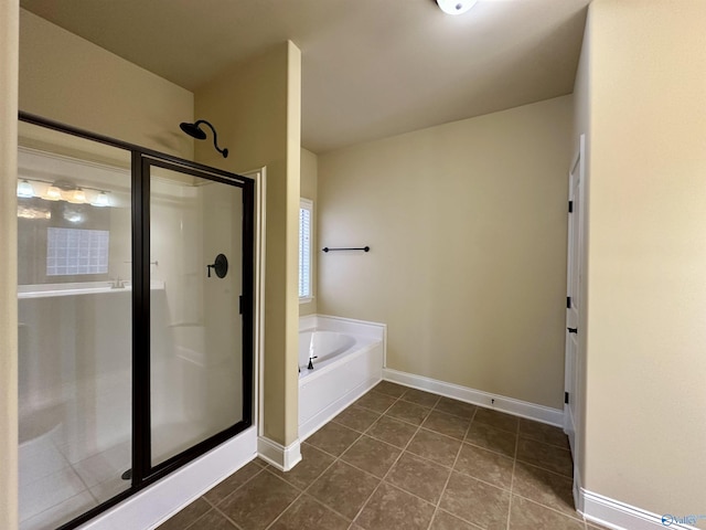 bathroom with separate shower and tub and tile patterned flooring