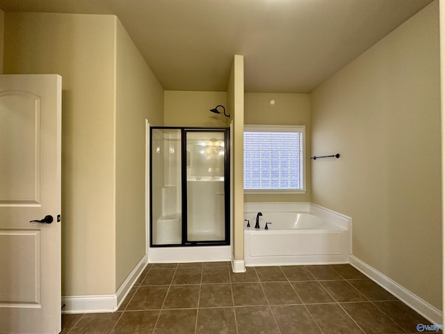 bathroom featuring tile patterned floors and plus walk in shower