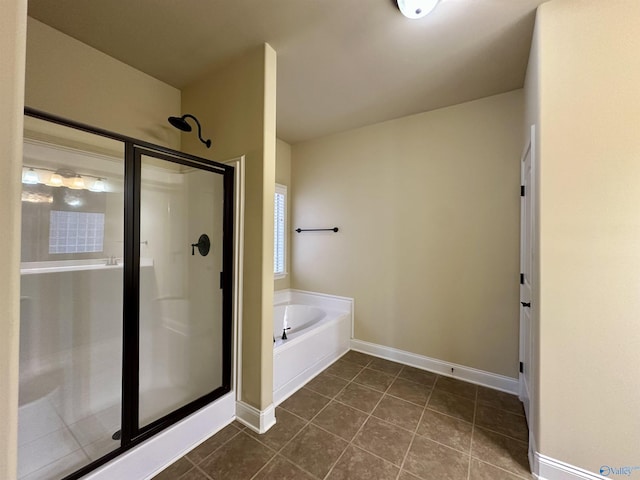 bathroom featuring tile patterned flooring and plus walk in shower