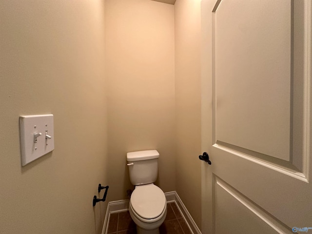 bathroom featuring tile patterned flooring and toilet