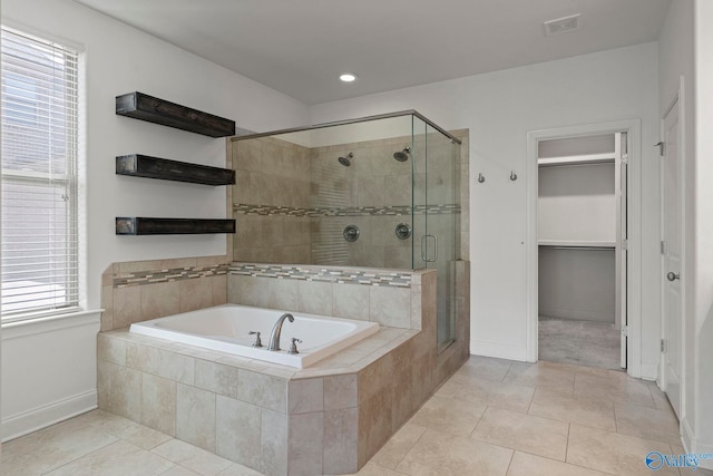 51 Summerlyn Way SE, Gurley, AL 35748 - bathroom with a garden tub, a stall shower, tile patterned floors, baseboards, and a walk in closet