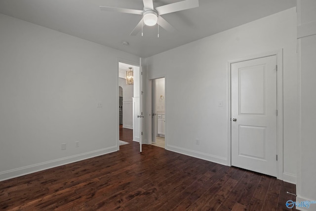51 Summerlyn Way SE, Gurley, AL 35748 - unfurnished bedroom featuring dark wood-type flooring, baseboards, ensuite bath, and a ceiling fan