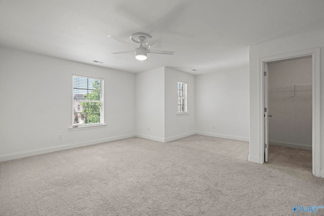 51 Summerlyn Way SE, Gurley, AL 35748 - unfurnished bedroom with light colored carpet, a spacious closet, baseboards, ceiling fan, and a closet