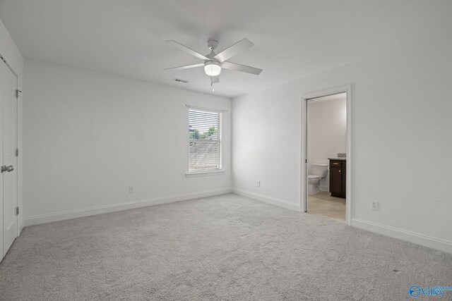 51 Summerlyn Way SE, Gurley, AL 35748 - unfurnished bedroom featuring light carpet, baseboards, ensuite bathroom, and ceiling fan