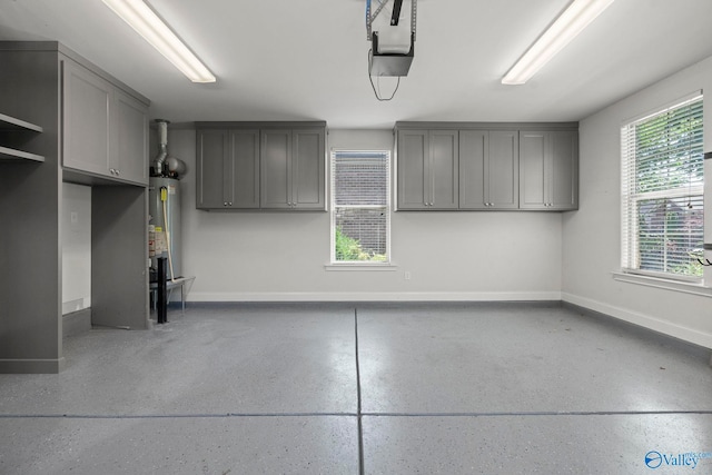 51 Summerlyn Way SE, Gurley, AL 35748 - garage featuring baseboards, water heater, and a garage door opener