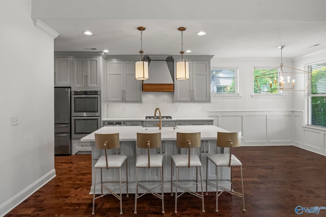 51 Summerlyn Way SE, Gurley, AL 35748 - kitchen with custom range hood, gray cabinetry, appliances with stainless steel finishes, light countertops, and a breakfast bar area