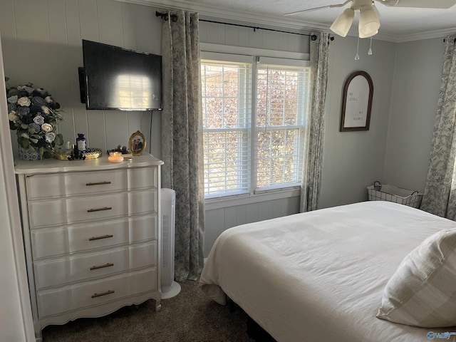 bedroom with carpet, ceiling fan, and ornamental molding