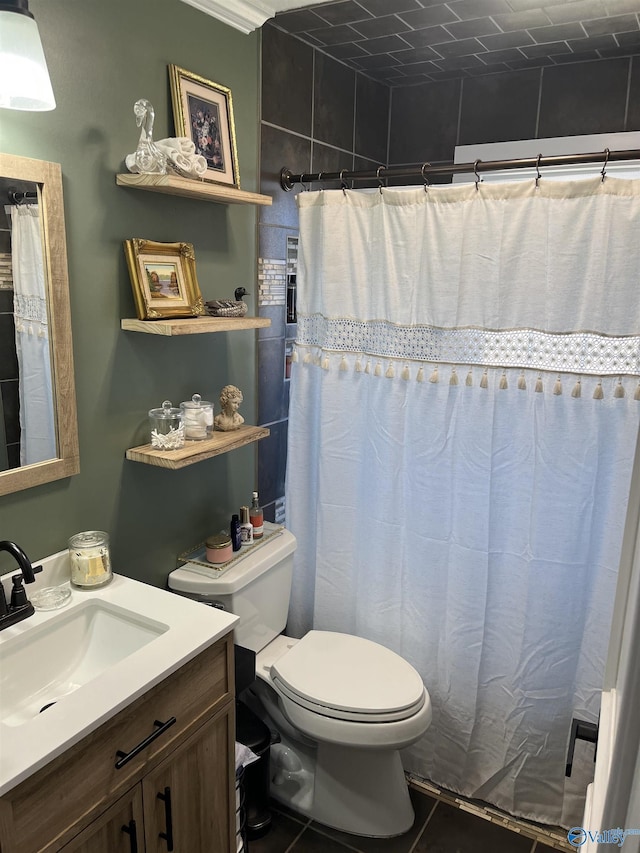 bathroom featuring tile patterned floors, toilet, vanity, and a shower with shower curtain