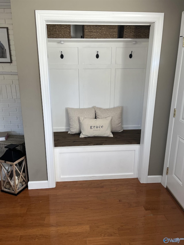 mudroom with dark hardwood / wood-style floors