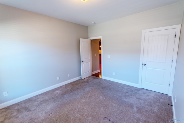 empty room with dark carpet