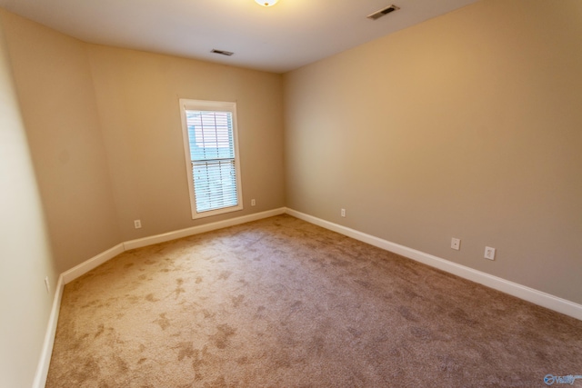 spare room with carpet flooring