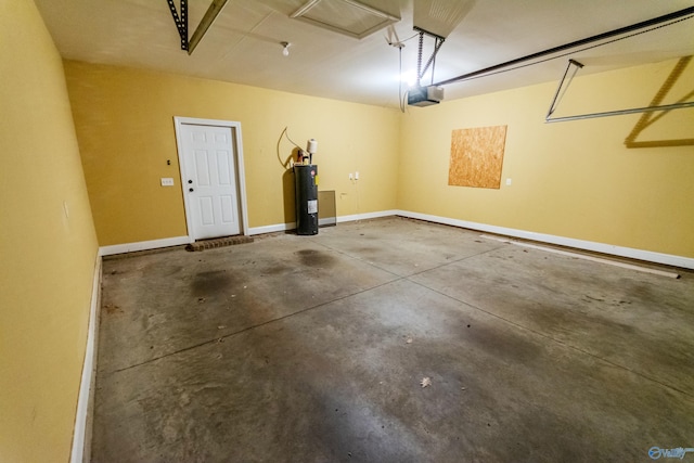 garage with electric water heater and a garage door opener