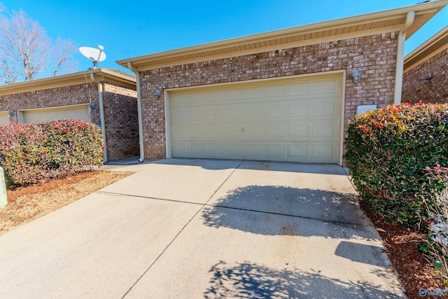 view of front of home featuring a garage and an outbuilding