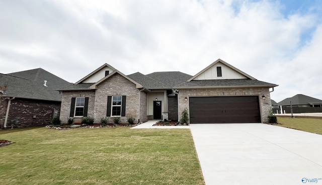 view of front of property featuring a garage and a front lawn