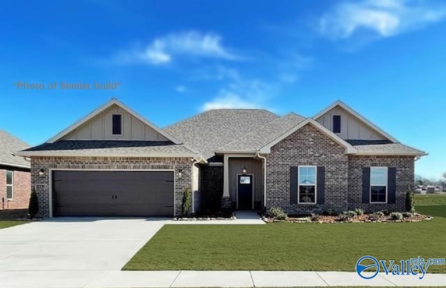 craftsman-style home featuring a front lawn and a garage