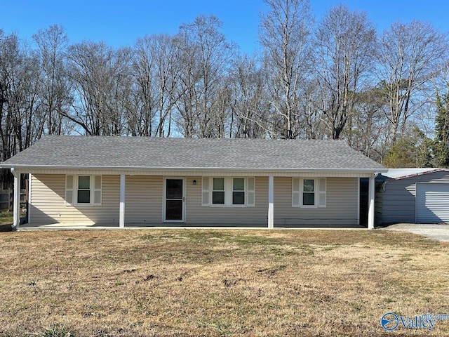 single story home featuring a garage and a front lawn