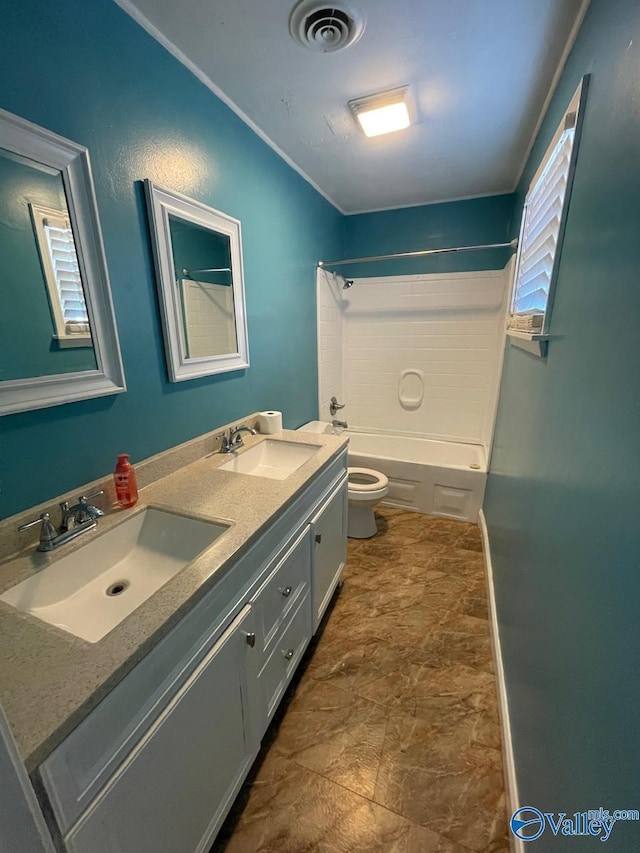 full bathroom with vanity, shower / tub combination, and toilet