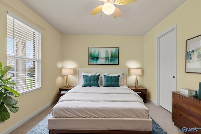 bedroom featuring ceiling fan and light colored carpet