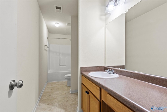 bathroom with toilet, a shower, and vanity