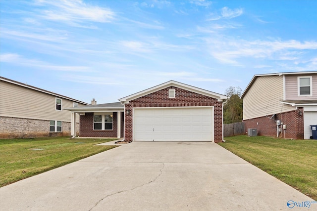 view of front of property featuring a front yard, a garage, and central AC unit