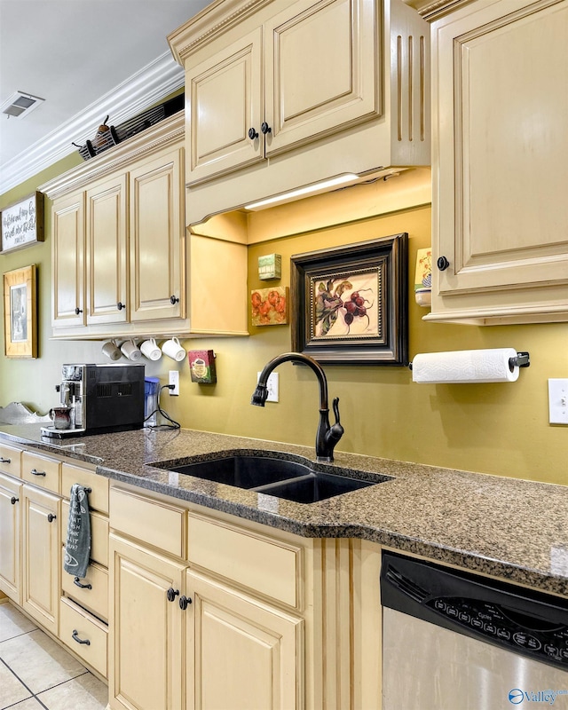 kitchen with dishwasher, crown molding, light tile patterned floors, sink, and dark stone countertops