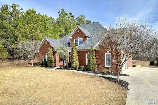front facade with a front lawn and a garage
