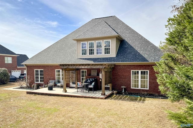 back of house featuring a patio and a yard