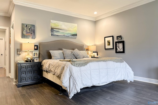 bedroom with crown molding and dark hardwood / wood-style flooring