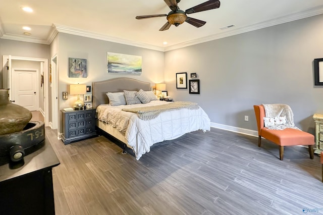 bedroom featuring ceiling fan, crown molding, and wood-type flooring