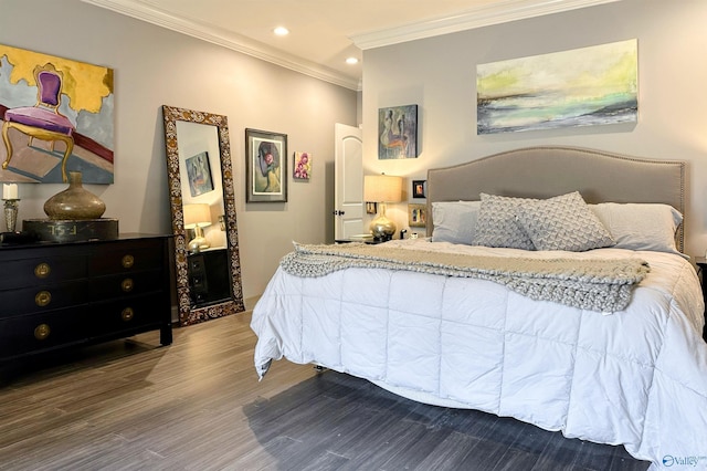 bedroom with ornamental molding and hardwood / wood-style floors