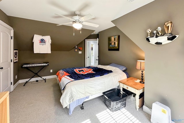 bedroom with vaulted ceiling, ceiling fan, and carpet floors